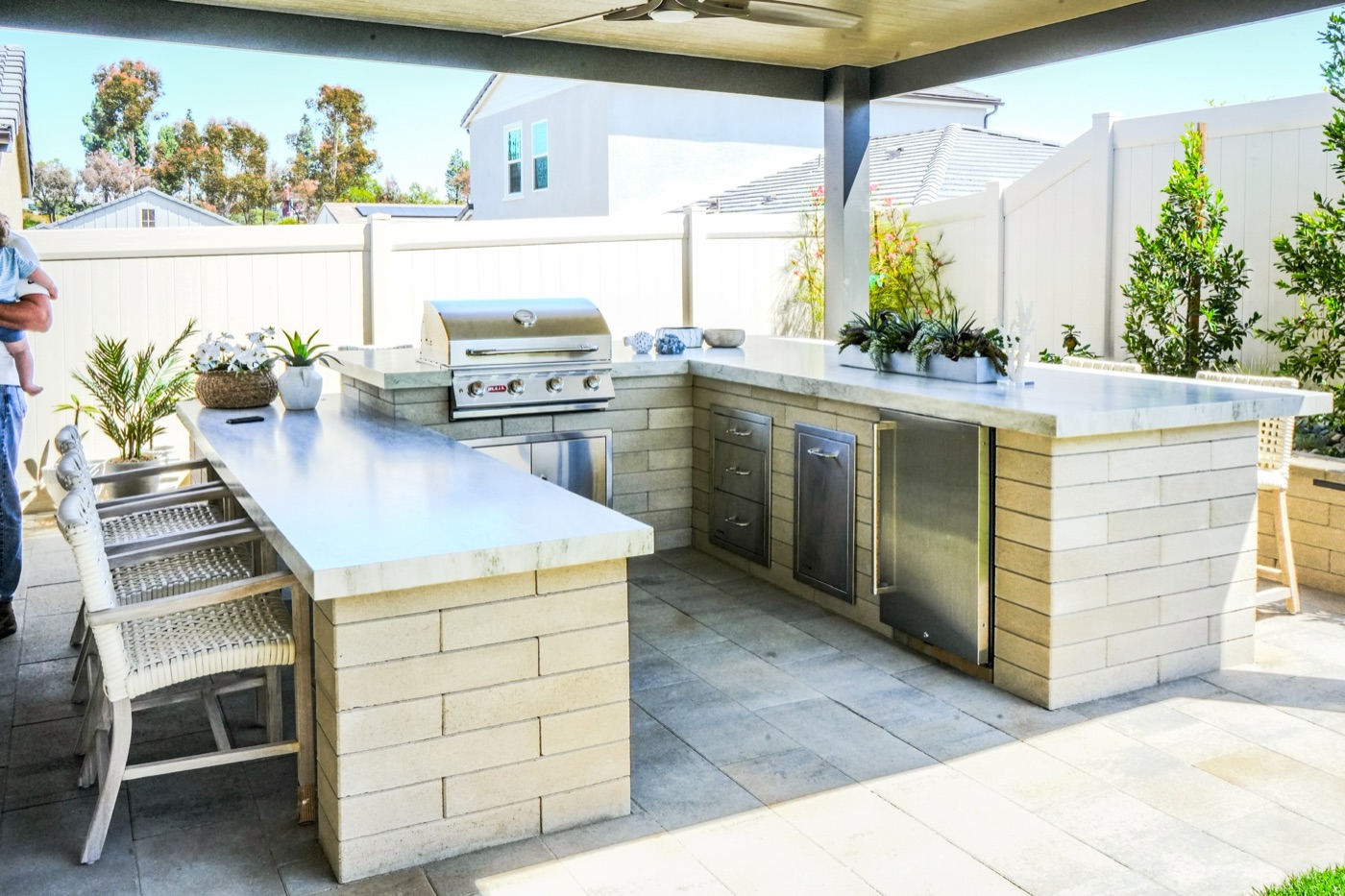 Covered outdoor kitchen and bar in Broussard by Abshire Brothers Lawn & Landscape