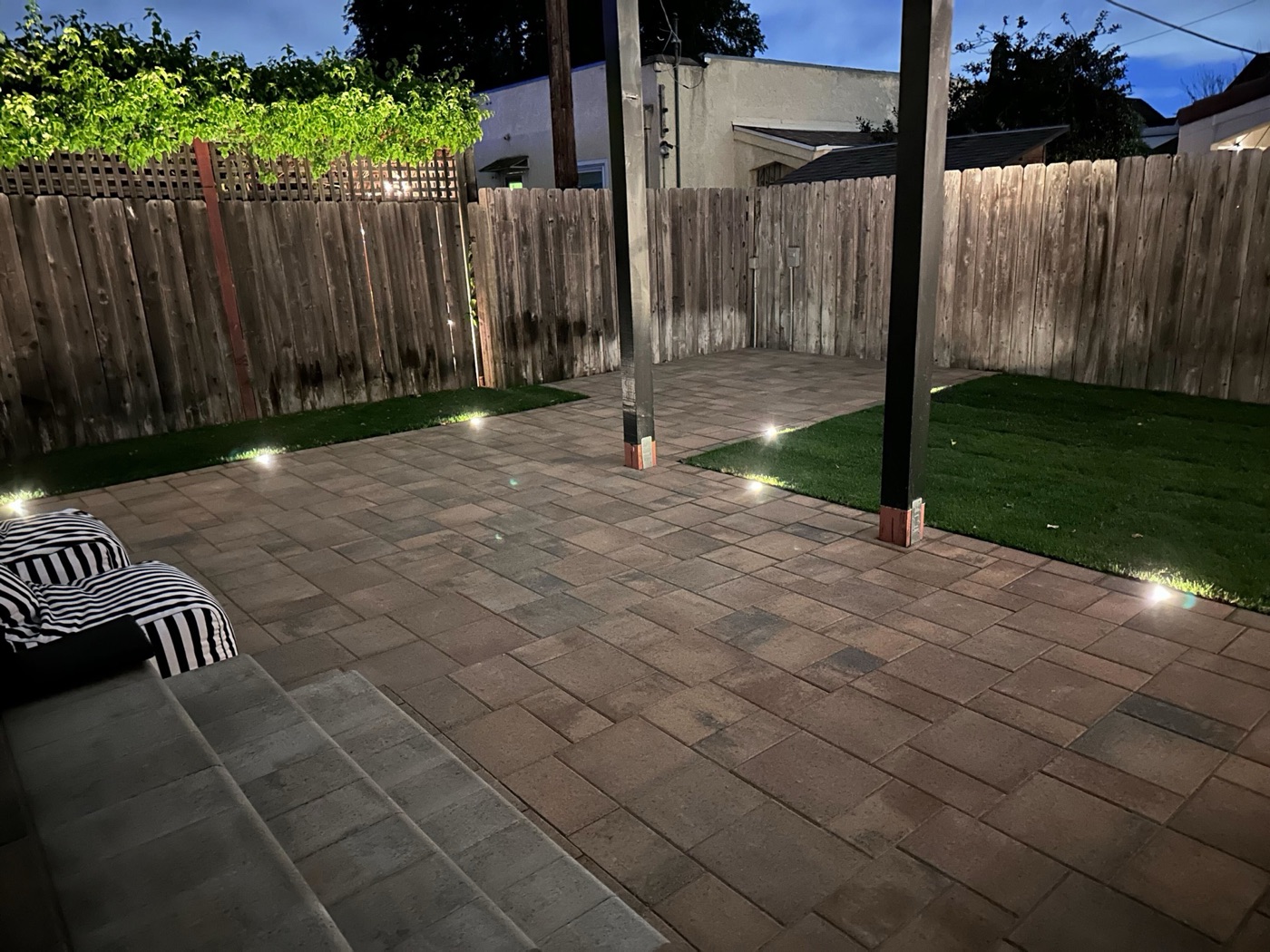 Outdoor kitchen with bar seating in Eunice by Abshire Brothers Lawn & Landscape