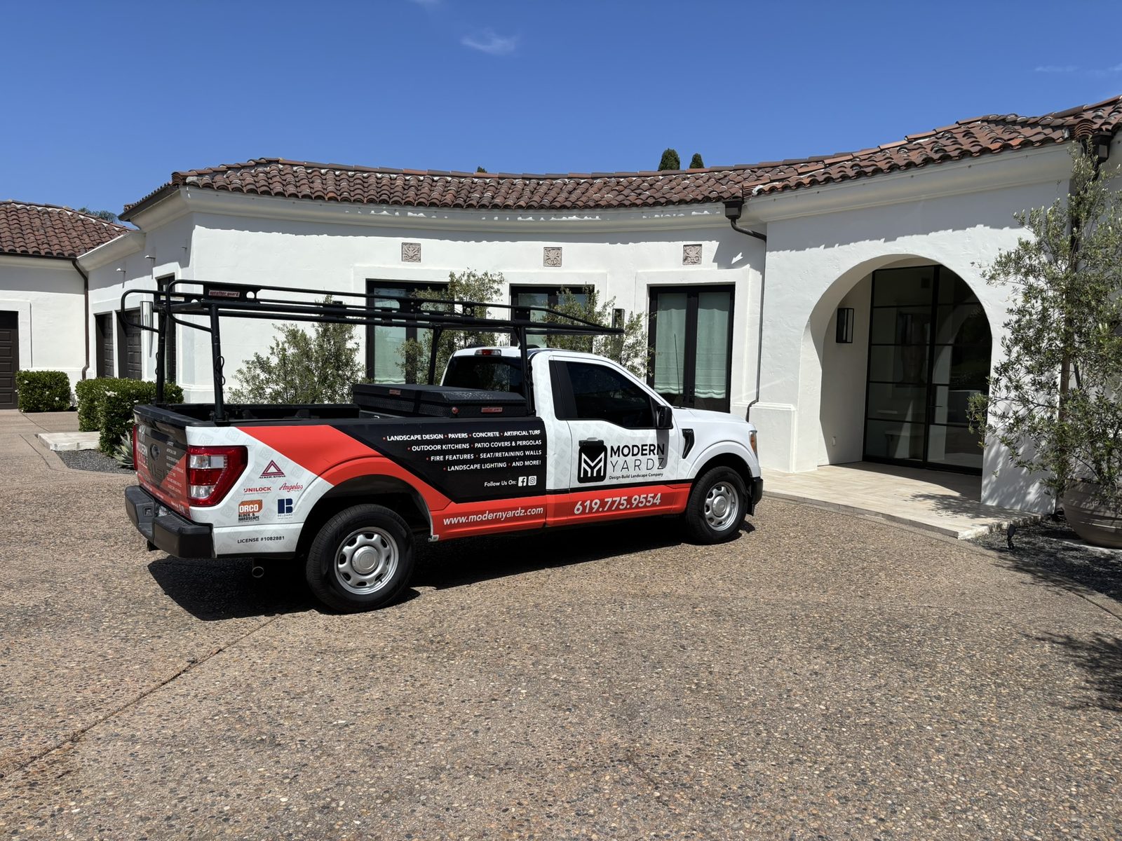 Abshire Brothers Lawn & Landscape branded truck parked at a Rayne home for a landscape design consultation